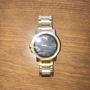 Beautiful black and gold puma watch!